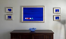 Grouping of five paintings in a home.